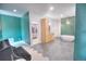 Luxurious bathroom with a soaking tub, walk-in closet, double vanity, hexagon tiles, and stylish finishes at 735 Woodmoor Acres Dr, Monument, CO 80132