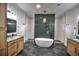 Elegant primary bathroom with dual vanities, soaking tub, and modern fixtures at 735 Woodmoor Acres Dr, Monument, CO 80132