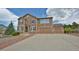 Charming two-story home with a three-car garage and low maintenance landscaping at 735 Woodmoor Acres Dr, Monument, CO 80132