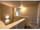 Upstairs hallway features natural lighting and view into a room at 735 Woodmoor Acres Dr, Monument, CO 80132