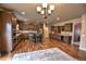 Spacious kitchen with stainless steel appliances, granite countertops, and a central island with seating at 735 Woodmoor Acres Dr, Monument, CO 80132