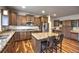 Well-appointed kitchen features granite countertops, stainless steel appliances, and a spacious center island at 735 Woodmoor Acres Dr, Monument, CO 80132