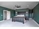Main bedroom features a fan and hanging lamps on each side of the bed at 735 Woodmoor Acres Dr, Monument, CO 80132