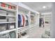 Spacious walk-in closet with custom shelving, drawers, and ample storage at 735 Woodmoor Acres Dr, Monument, CO 80132