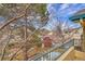 Balcony view showcasing trees, rooftops, and blue skies with some visible bare branches at 8747 E Dry Creek Rd # 1623, Englewood, CO 80112