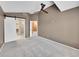 Bedroom with ceiling fan, carpet, and doors leading to a bathroom and closet, creating a functional space at 8747 E Dry Creek Rd # 1623, Englewood, CO 80112