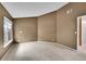 Angled view of a bedroom with a large window and neutral carpet and walls at 8747 E Dry Creek Rd # 1623, Englewood, CO 80112