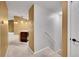 Hallway and staircase leading to the lower level of the home at 8747 E Dry Creek Rd # 1623, Englewood, CO 80112