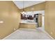 Modern kitchen with dark cabinetry, a stylish breakfast bar, and stainless steel appliances, perfect for cooking at 8747 E Dry Creek Rd # 1623, Englewood, CO 80112