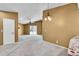 Open-concept living space, enhanced by large windows, neutral paint, and access to a sliding glass door at 8747 E Dry Creek Rd # 1623, Englewood, CO 80112