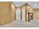 Home's entryway featuring modern flooring and a fireplace, with a stylish front door and neutral-toned walls at 8747 E Dry Creek Rd # 1623, Englewood, CO 80112