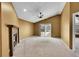 A cozy living room with a fireplace, vaulted ceilings, and a sliding glass door to the balcony at 8747 E Dry Creek Rd # 1623, Englewood, CO 80112
