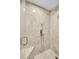 Tiled walk-in shower with glass door and multiple shower heads, modern design and functionality at 8747 E Dry Creek Rd # 1623, Englewood, CO 80112