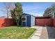 Backyard featuring a shed, green lawn, landscaping, concrete pavers and wood fencing at 1144 S Logan St, Denver, CO 80210