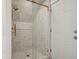 The bathroom features a frameless shower with white tile and gold hardware at 1144 S Logan St, Denver, CO 80210