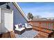 Outdoor deck with seating, pillows, and a patterned rug at 1144 S Logan St, Denver, CO 80210