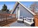 Outdoor deck with seating, pillows, and a patterned rug at 1144 S Logan St, Denver, CO 80210