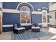 Cozy porch featuring comfortable seating, a stylish outdoor rug, and a charming curb appeal at 1144 S Logan St, Denver, CO 80210