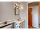 Bathroom with a sink, mirror, and vanity at 7106 Reed Cir, Arvada, CO 80003