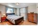 Cozy bedroom featuring hardwood floors, and ample natural light at 7106 Reed Cir, Arvada, CO 80003