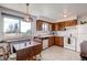 Bright kitchen featuring ample cabinet space and a breakfast nook at 7106 Reed Cir, Arvada, CO 80003