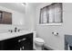 Stylish powder room with elegant vanity, marble countertop, modern fixtures, and sophisticated decor at 7507 Braun St, Arvada, CO 80005