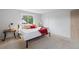 Comfortable bedroom with natural light, cozy carpet, and stylish bedside tables, creating a serene atmosphere at 7507 Braun St, Arvada, CO 80005