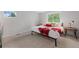 Cozy bedroom with natural light, plush carpet, and decorative pillows, creating a relaxing retreat at 7507 Braun St, Arvada, CO 80005