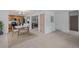 Bright dining area with stylish lighting, kitchen access and neutral tones offer a cozy atmosphere at 7507 Braun St, Arvada, CO 80005
