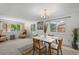 Inviting dining area filled with natural light, complemented by neutral walls and cozy seating at 7507 Braun St, Arvada, CO 80005