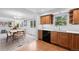 Charming open-concept dining area near kitchen with bright lighting and coffee and dining space at 7507 Braun St, Arvada, CO 80005