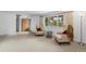 Inviting living room with large window and comfortable seating bathed in natural light at 7507 Braun St, Arvada, CO 80005