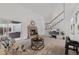 Bright living room with a charming brick fireplace, plush seating, and sliding doors leading to the backyard at 7507 Braun St, Arvada, CO 80005
