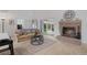 Cozy living room with a fireplace and access to outdoor patio at 7507 Braun St, Arvada, CO 80005