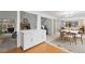 Open-concept living space with dining area, kitchen, and cozy seating, perfect for entertaining at 7507 Braun St, Arvada, CO 80005