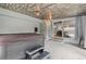 This sunroom features a hot tub, wood plank ceiling and seamless flow to the dining room via sliding glass doors at 7507 Braun St, Arvada, CO 80005