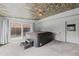 Bright sunroom featuring a hot tub, decorative ceiling, and access to the backyard and other parts of the home at 7507 Braun St, Arvada, CO 80005