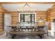 Comfortable dining room with large table and bench seating, perfect for Gathering gatherings at 1651 Pine Valley Rd, Evergreen, CO 80439