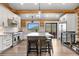 Spacious kitchen with an island, bar stool seating, and stainless steel appliances at 1651 Pine Valley Rd, Evergreen, CO 80439