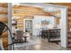 Open kitchen with a subway tile backsplash, stainless steel appliances, and adjacent dining area at 1651 Pine Valley Rd, Evergreen, CO 80439