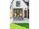 Relaxing patio features outdoor dining, plenty of green grass and a modern design at 510 Glencoe St, Denver, CO 80220