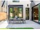 Backyard patio with an outdoor dining area, perfect for entertaining and enjoying the outdoors at 510 Glencoe St, Denver, CO 80220