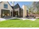 Expansive backyard with seating areas and a dining space perfect for outdoor entertaining at 510 Glencoe St, Denver, CO 80220