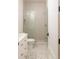 Sleek bathroom boasts stylish floor tile, a glass-enclosed shower, and white cabinets at 510 Glencoe St, Denver, CO 80220