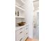 Bright Butler Pantry featuring modern cabinetry, open shelving, and designer decor at 510 Glencoe St, Denver, CO 80220