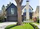 Stunning two-story home featuring manicured lawn, modern design, and a large tree in front at 510 Glencoe St, Denver, CO 80220
