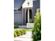 Inviting entrance featuring a modern door, stylish brickwork, and professional landscaping at 510 Glencoe St, Denver, CO 80220