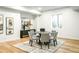 Finished basement game room featuring a round table, chairs, and unique decorative art at 510 Glencoe St, Denver, CO 80220