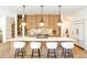 Gourmet kitchen featuring modern cabinetry, a spacious island, and stainless steel appliances at 510 Glencoe St, Denver, CO 80220