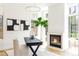 Bright living room with a cozy fireplace, stylish decor, and plenty of natural light at 510 Glencoe St, Denver, CO 80220